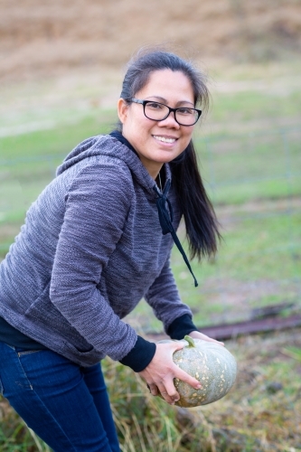Picking a pumpkin in the garden