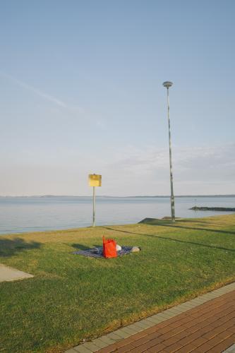 Picnic on the grass looking over the bay - Australian Stock Image