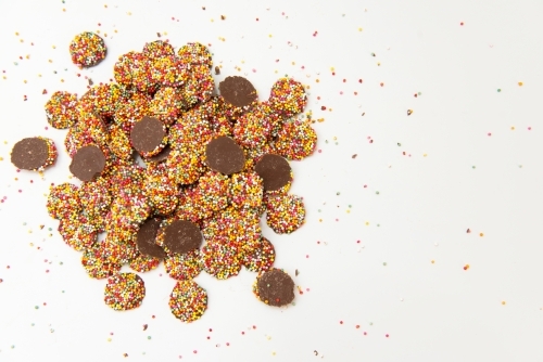 Pile of chocolate freckles with sprinkles - Australian Stock Image