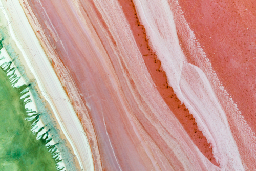 Pink and green salt lake patterns viewed from above. - Australian Stock Image