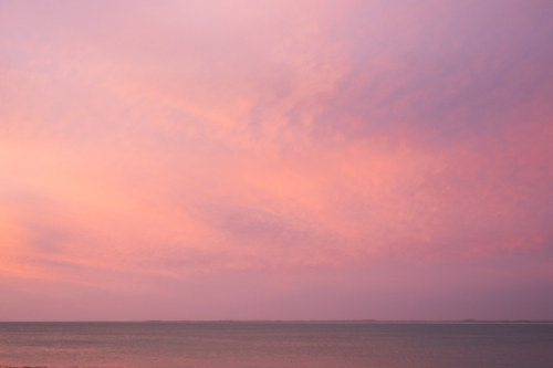 Pink sunset landscape over the ocean - Australian Stock Image