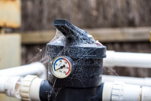 Pool Spa Filter Water Pressure Gauge with spider web. - Australian Stock Image