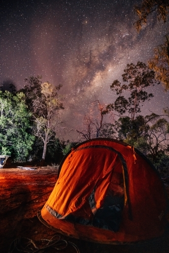 Pop up tent set up in the bush with a starry sky