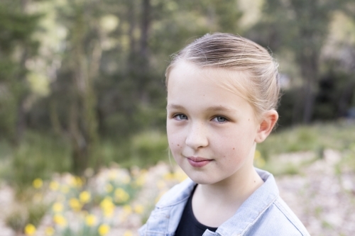 Portrait of a girl standing outdoors - Australian Stock Image