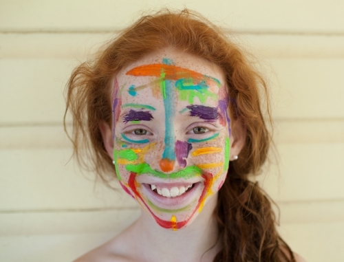 Portrait of a girl with paint on her face - Australian Stock Image