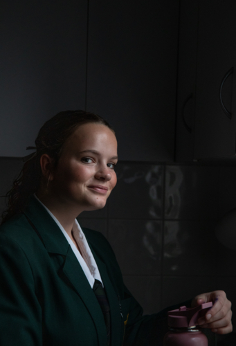 Portrait of a high school student smiling - Australian Stock Image