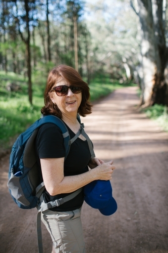 Portrait of a middle aged lady on a bush walk - Australian Stock Image