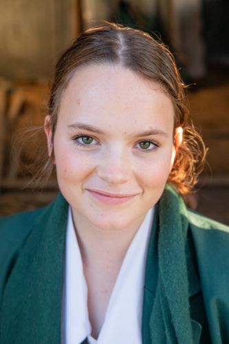 Portrait of a school girl smiling - Australian Stock Image