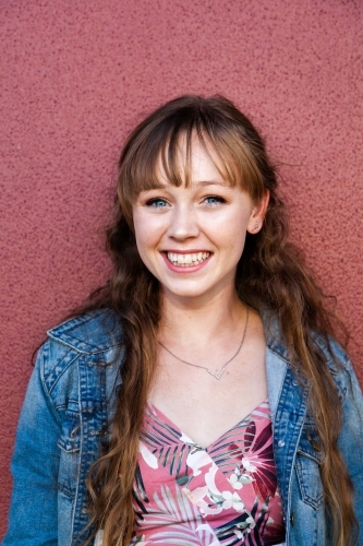 Portrait of a smiling young woman in her late teens - Australian Stock Image
