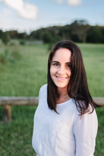 Portrait of a woman outdoors in a field - Australian Stock Image