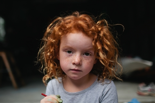 Portrait of a young girl with a serious expression - Australian Stock Image