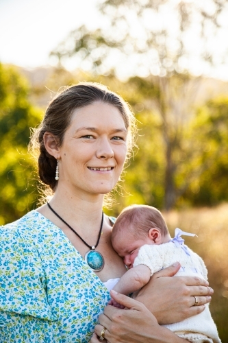 Portrait of a young mother and her newborn baby girl - Australian Stock Image