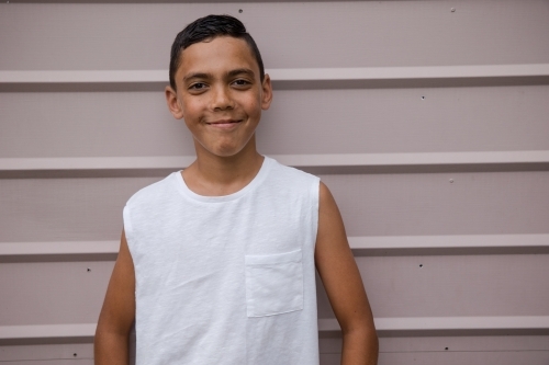 Portrait of a young, smiling first nations boy - Australian Stock Image