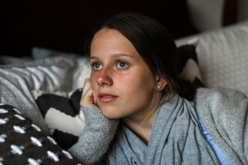 Portrait of a young teenage girl indoors - Australian Stock Image