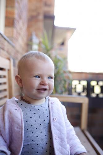 Portrait of baby girl looking away - Australian Stock Image