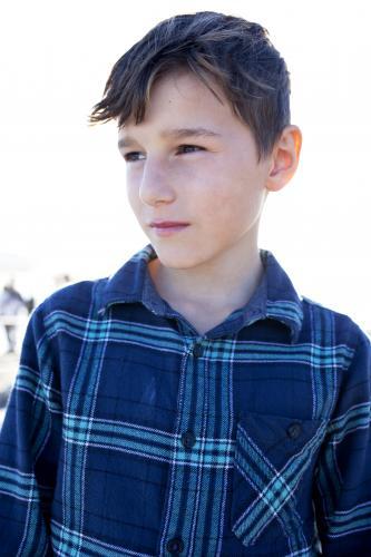 Portrait of boy looking away - Australian Stock Image
