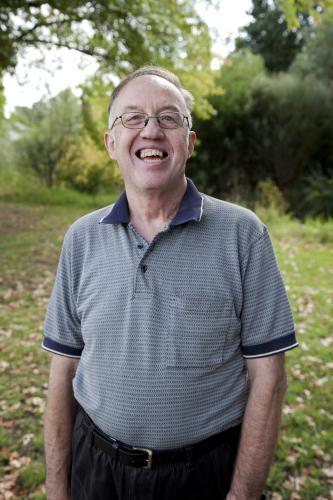 Portrait of happy disabled man standing outside - Australian Stock Image