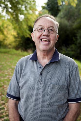 Portrait of happy man with a disability standing outside - Australian Stock Image