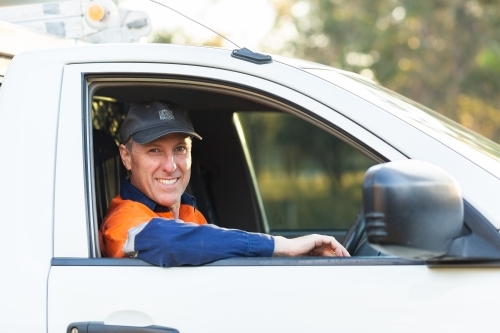 portrait of middle aged aussie man in work ute - Australian Stock Image