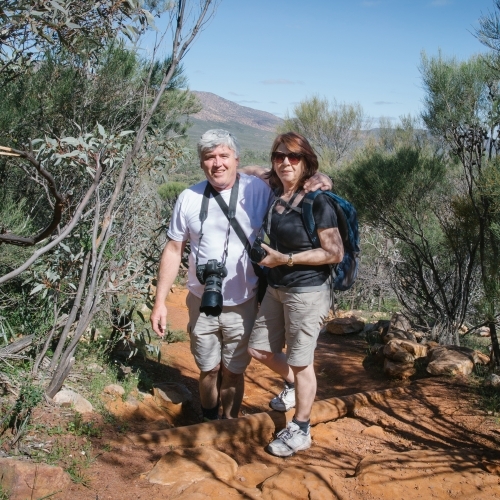 Portrait of middle aged couple in the flinders ranges on a bush walk - Australian Stock Image
