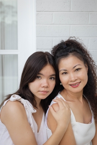 Portrait of mother and daughter together - Australian Stock Image