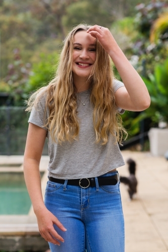 portrait of happy teen in jeans and tee-shirt - Australian Stock Image