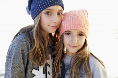 Portrait of two young girls by the ocean - Australian Stock Image