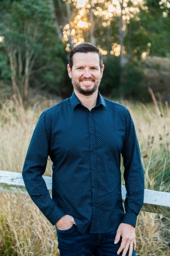 Portrait of well-dressed man standing in the bushland - Australian Stock Image