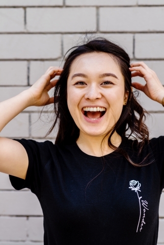 portrait of young, laughing asian woman - Australian Stock Image