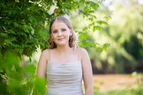 Portrait of young woman in park - Australian Stock Image