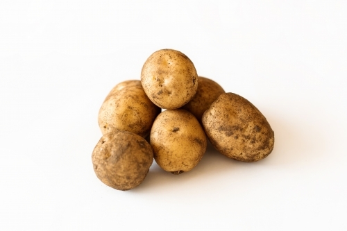Potatoes on white backdrop