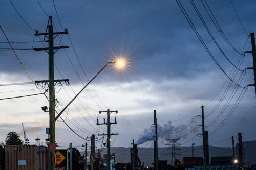 Powerlines and smoke from factory - Australian Stock Image