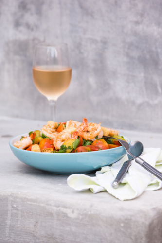 Prawn salad with a chilled glass of rose - Australian Stock Image