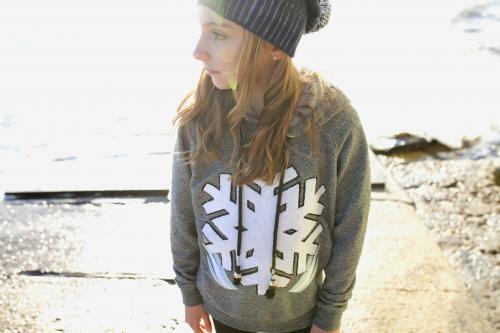 Pre teen girl standing on a boat ramp looking away in the afternoon light - Australian Stock Image