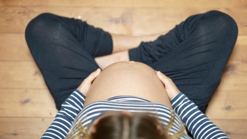Pregnant belly shot from above - Australian Stock Image