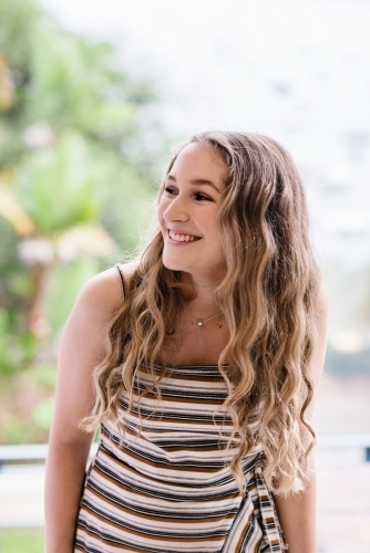 pretty teen with long curly hair - Australian Stock Image