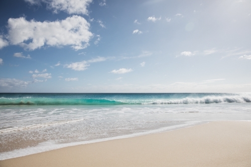 Pristine beach looking out to sea in morning light - Australian Stock Image