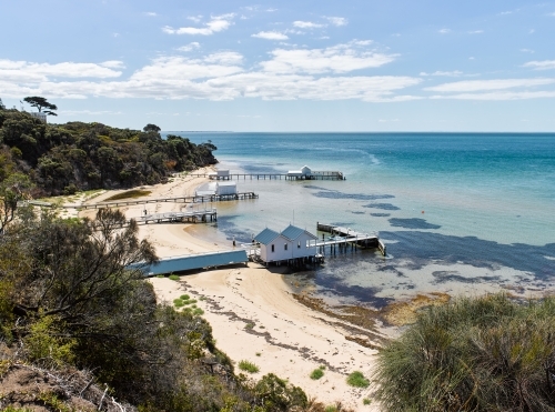 private jetties & boat sheds from cliffside walkway - Australian Stock Image