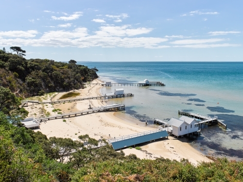 private jetties & boat sheds from cliffside walkway - Australian Stock Image