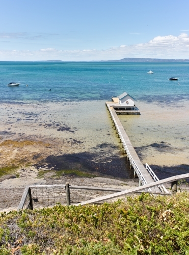 Private Jetty & boat shed from cliffside walkway - Australian Stock Image