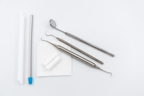 Professional dental instruments on white background - Australian Stock Image