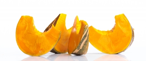Pumpkin slices on white background - Australian Stock Image