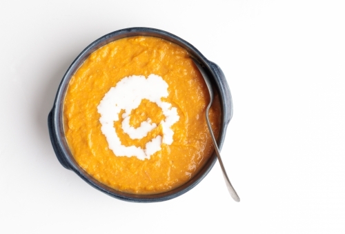 Pumpkin soup with sour cream - Australian Stock Image