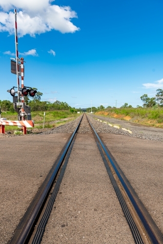 Rail tracks in Queensland countryside during summer - Australian Stock Image