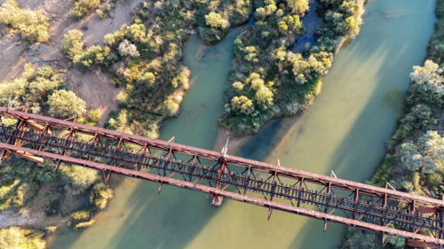Railway bridge over river - Australian Stock Image