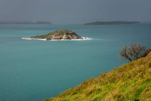 Rain over island - Australian Stock Image