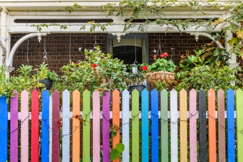 rainbow coloured fence and terrace - Australian Stock Image
