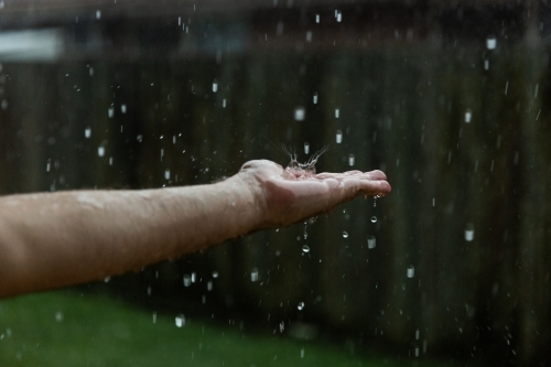 raindrop splashing on a hand