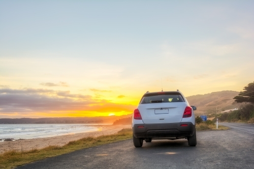 Rear view of car at sunset
