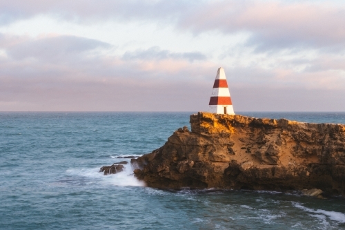 Red and white Robe Obelisk at sunset - Australian Stock Image